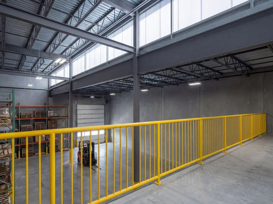 Steel mezzanine with yellow safety rail inside a Fresh Haul Logistics warehouse unit